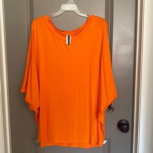 Orange dolman top. Loose fitting, very soft fabric.